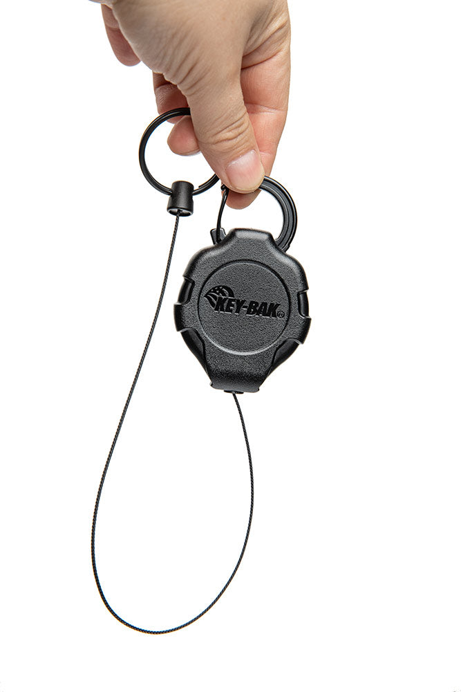 The ratcheting function locks the cord in place. Give it a tug; and it reels back in.