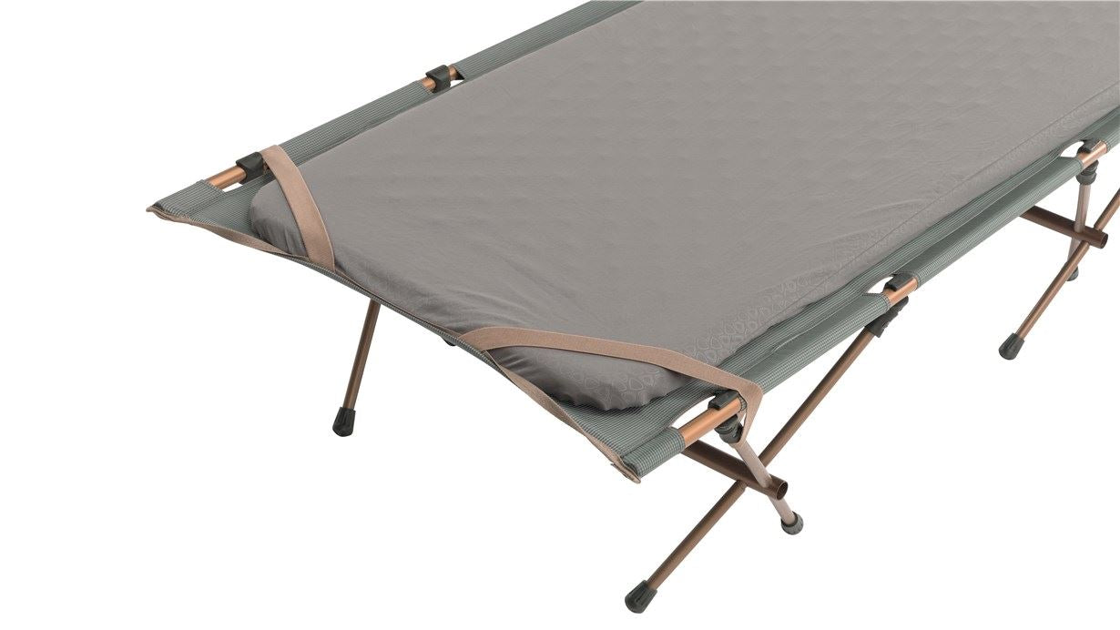 Elastic straps in the corners for securing a sleeping pad.