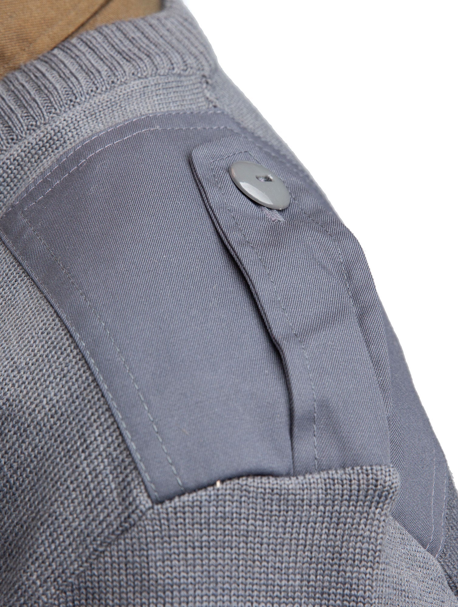 Button-closed epaulets.