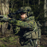 Man in the forest holding an AR 15 and dressed in Varusteleka gear, including the L3 Softshell