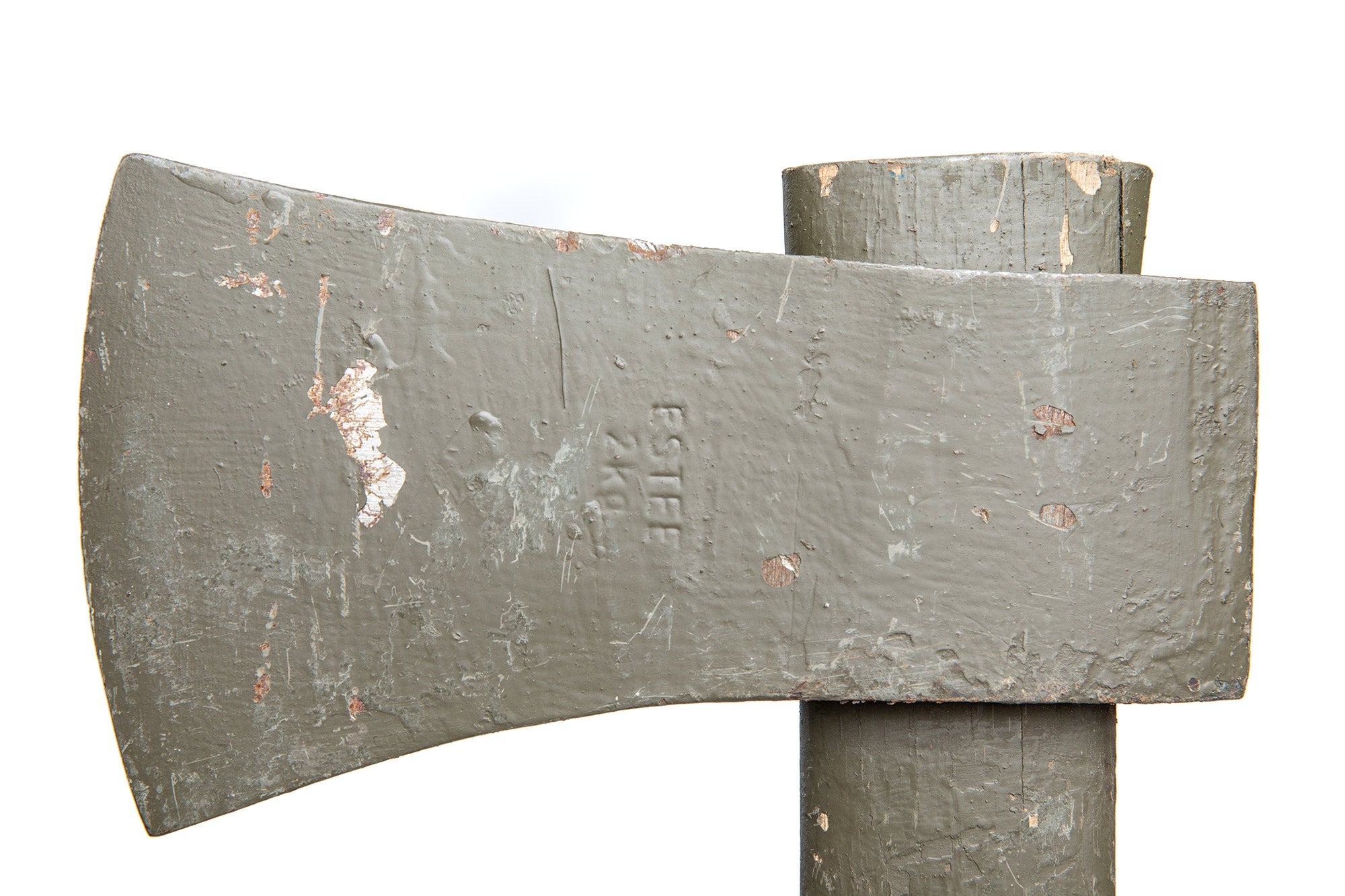 A close up of the green Dutch military axe head from the left side.