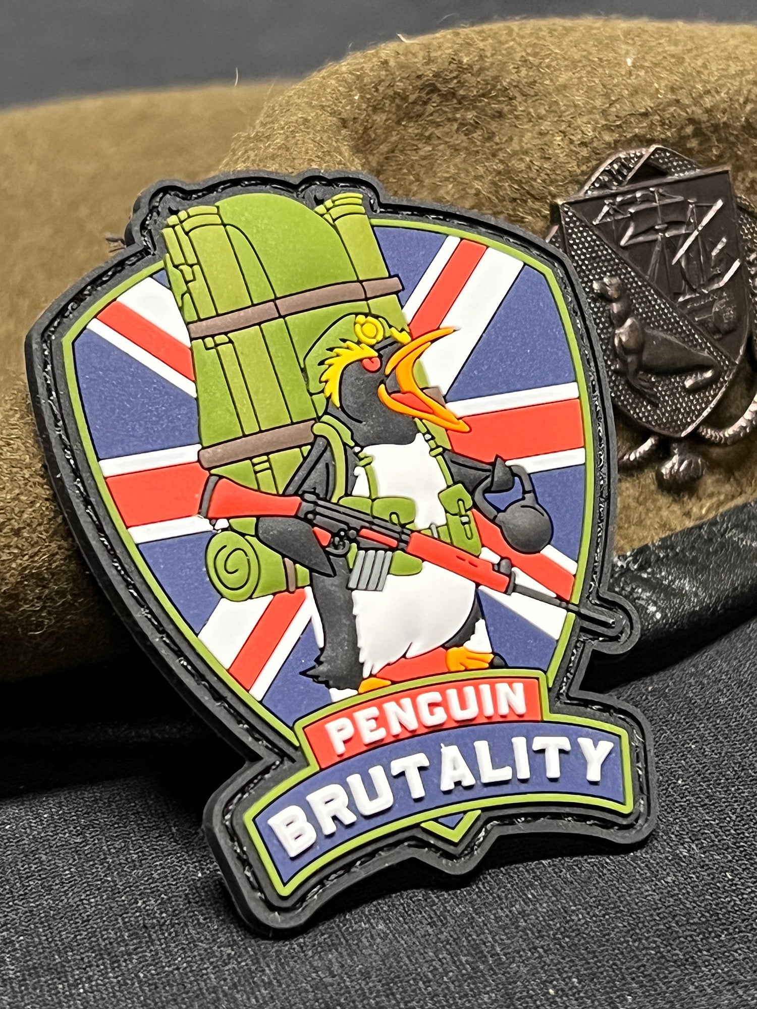forgotten-weapons-penguin-brutality-morale-patch-0676e5db5de7d1.jpg