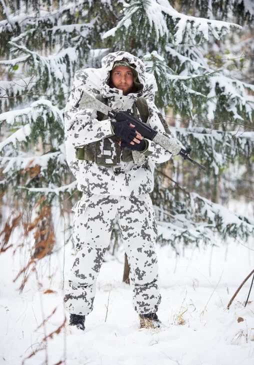 Snow wrap on the vest, reversed Woodland Digital on the rifle.