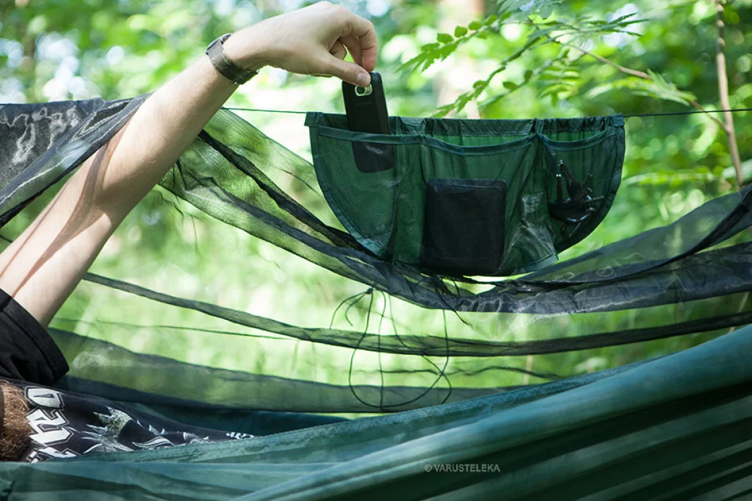 A hanging pouch for all your small trinkets is included.