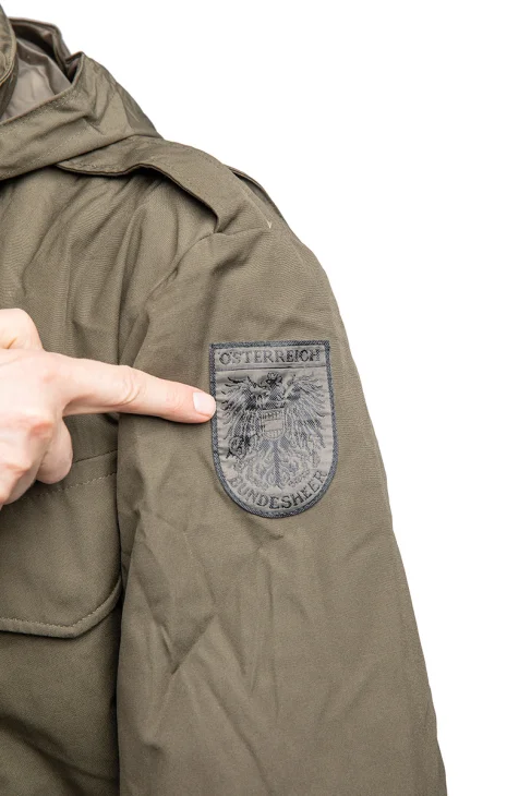 Are you ready for your new identity? Looks like virtually all of the jackets have the Austrian Bundesheer patch on the arm.