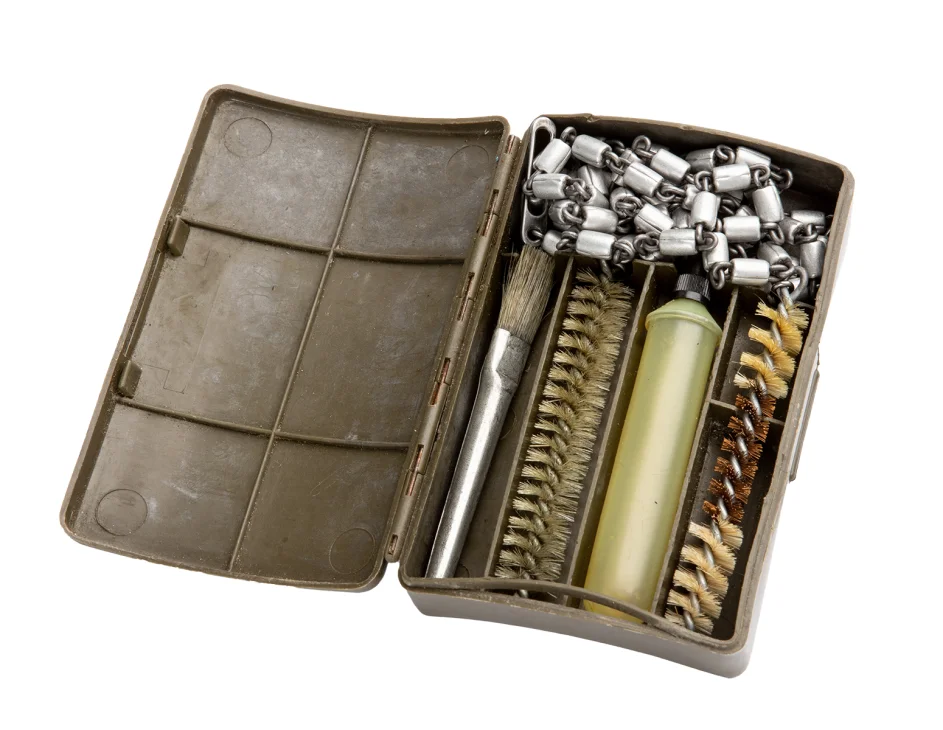 A plastic box full of cleaning stuff for.30-caliber guns.