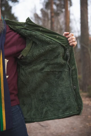 The faux fur liner buttons up inside the shell coat and won't come off on its own.