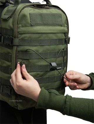 A Tri-Tab and length of shock cord used to make a simple lashing system for a backpack.