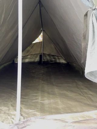 The ridge slopes towards the end of the tent.