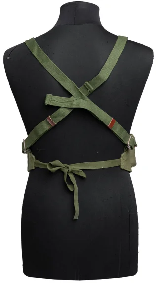 The adjustable shoulder straps cross each other at the back and the waist belt strings are tied together at the back.