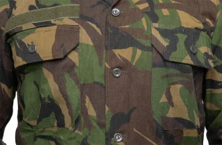 The field shirt has two breast pockets a spot for the name tag on the right.