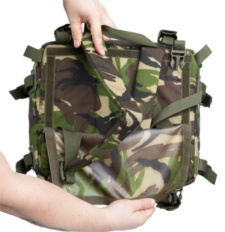 You can hide the shoulder straps of the daypack under a hook and loop panel.