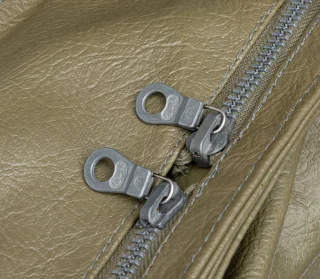 The bag has high-quality zippers by Riri.