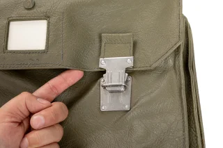 The bag has heavy-duty snap buckles.