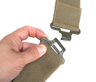 The buckle is closed by inserting it through the rectangular loop.