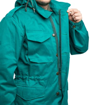 A zipper-closure and a button-closed wind flap in the front.